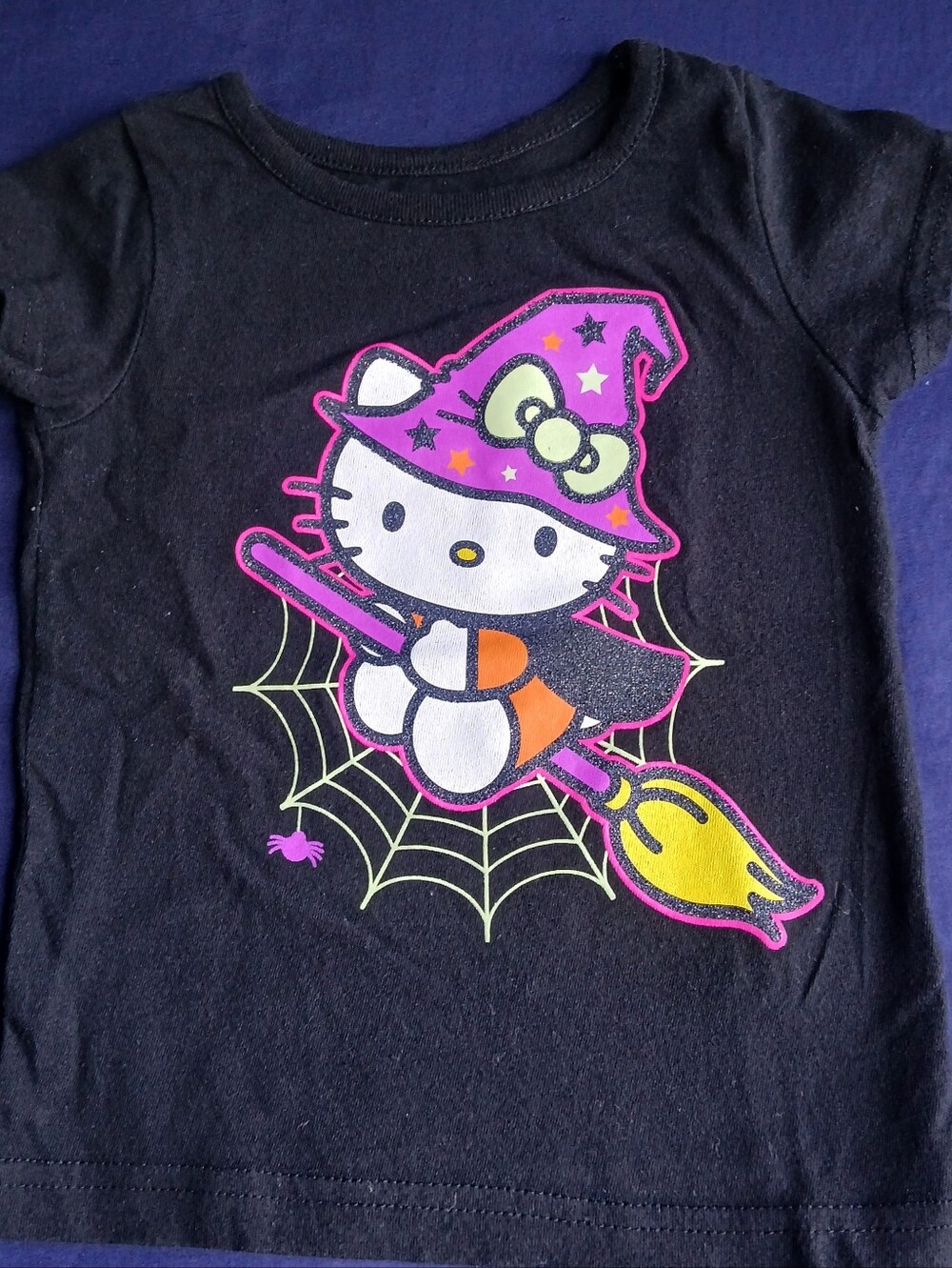Hello Kitty Black Tee with Purple Witch Hat and Yellow Broom